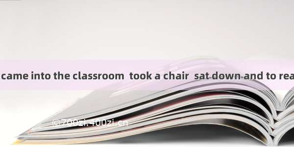 The girl student came into the classroom  took a chair  sat down and to read very comforta